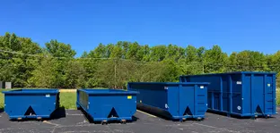Blue roll-off dumpsters in several sizes for comparing dumpster rental options